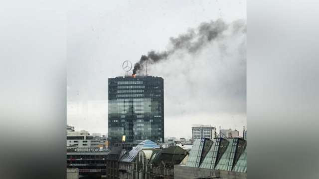 Berlin’s landmark Europa-Center tower on fire